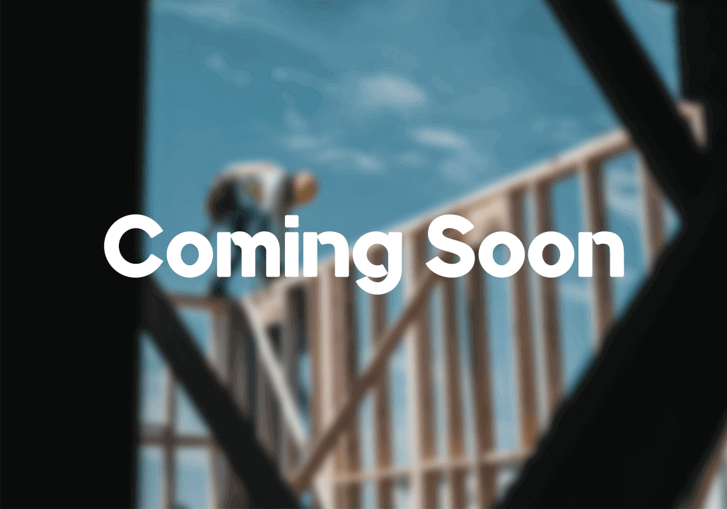 Construction site with the words 'coming soon' written on it